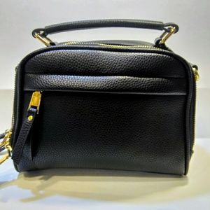 Madison West Black small purse with gold hardware.